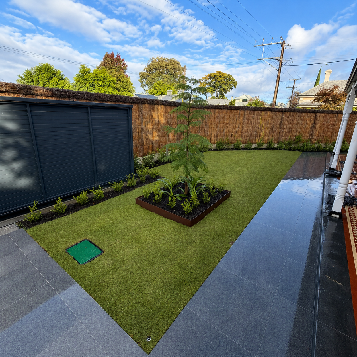 Designed garden with structured planting and a built landscape