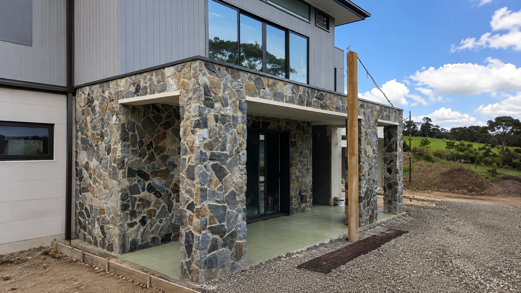 Armadale residence exterior with random-stone cladding to facade and portico
